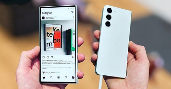 A hand holding a cell phone
Description automatically generated