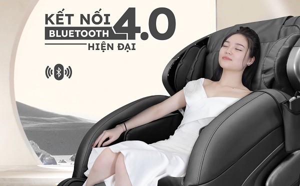 A person in a white dress sitting in a massage chair
Description automatically generated