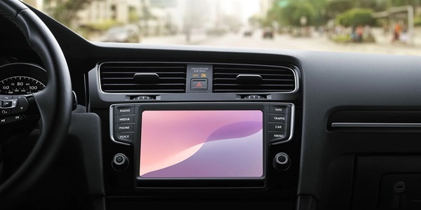 A car dashboard with a screen
Description automatically generated
