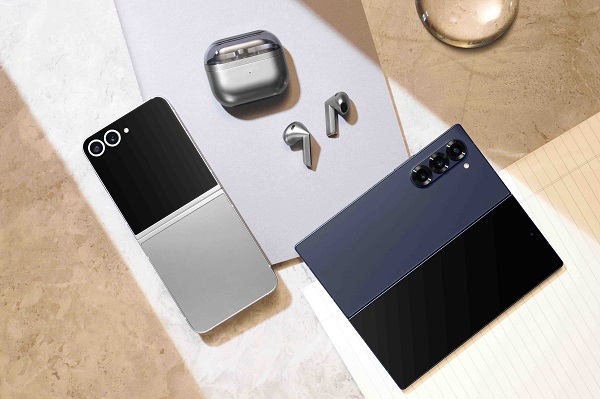 A cell phone and earphones on a table
Description automatically generated