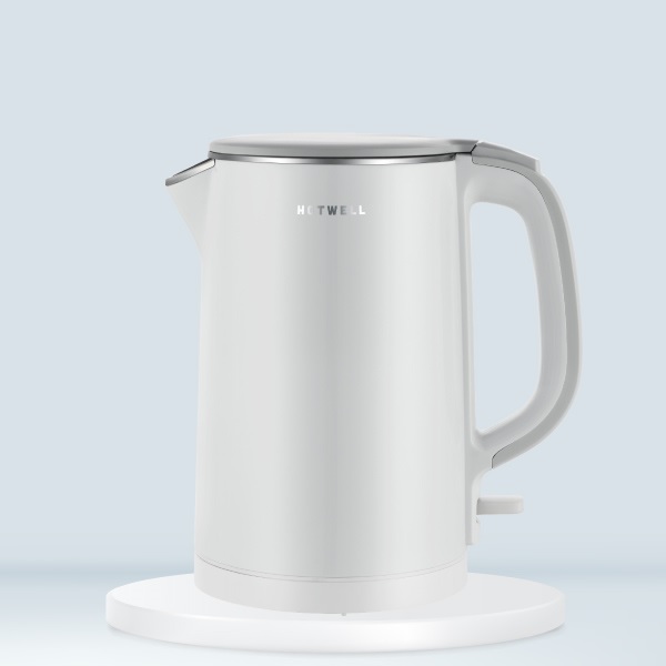 A white kettle on a white surface

Description automatically generated