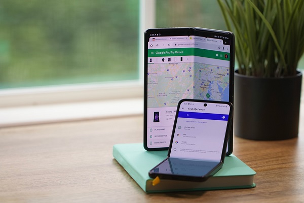 A smartphone and a book on a table
Description automatically generated