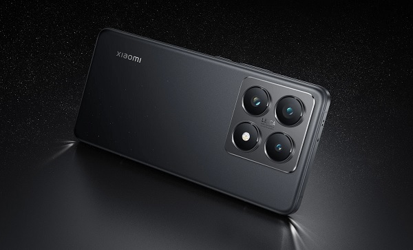 A black rectangular device with four circular buttons

Description automatically generated