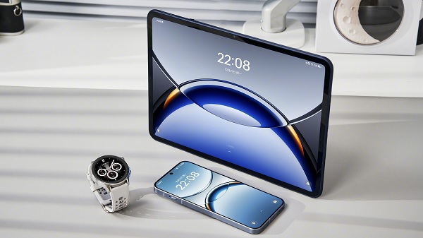 A tablet and phone on a table
Description automatically generated